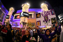 LOS ANGELES, CALIFORNIA - JANUARY 26:  Victor Nava holds up his sign at LA Live to pay tribute to Kobe Bryant who died earlier in a helicopter crash on January 26, 2020 in Los Angeles, California. (Photo by Harry How/Getty Images)