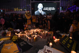 LOS ANGELES, CALIFORNIA - JANUARY 26:  Fans gather at LA Live to pay tribute to Kobe Bryant who died earlier in a helicopter crash on January 26, 2020 in Los Angeles, California. (Photo by Harry How/Getty Images)